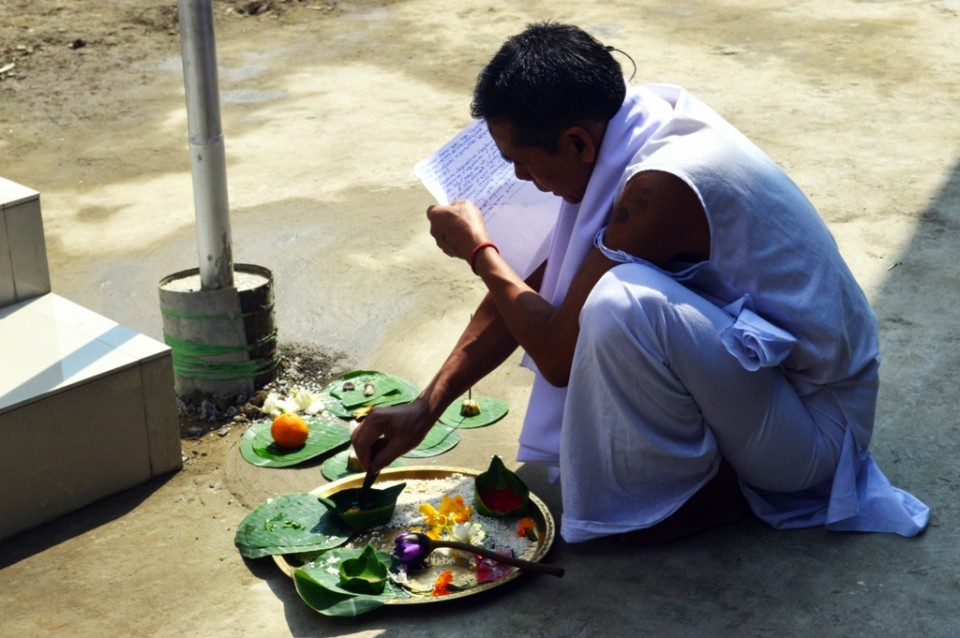 A priest blesses the new temple